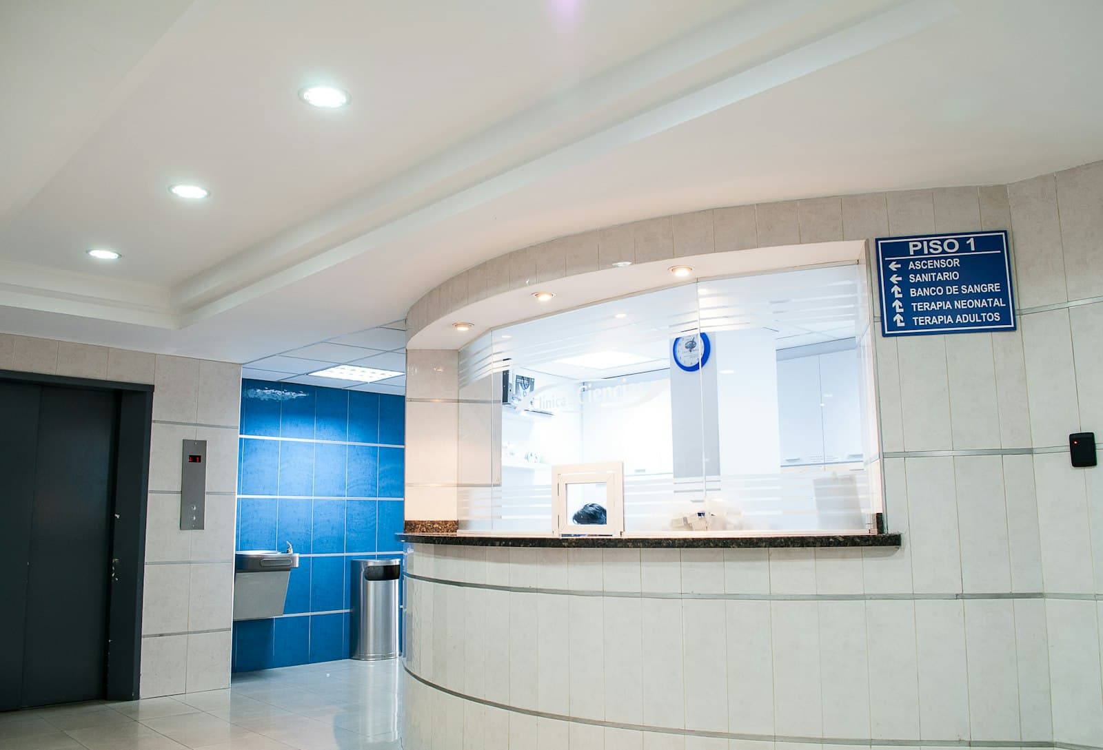 A clinic reception desk and hallway