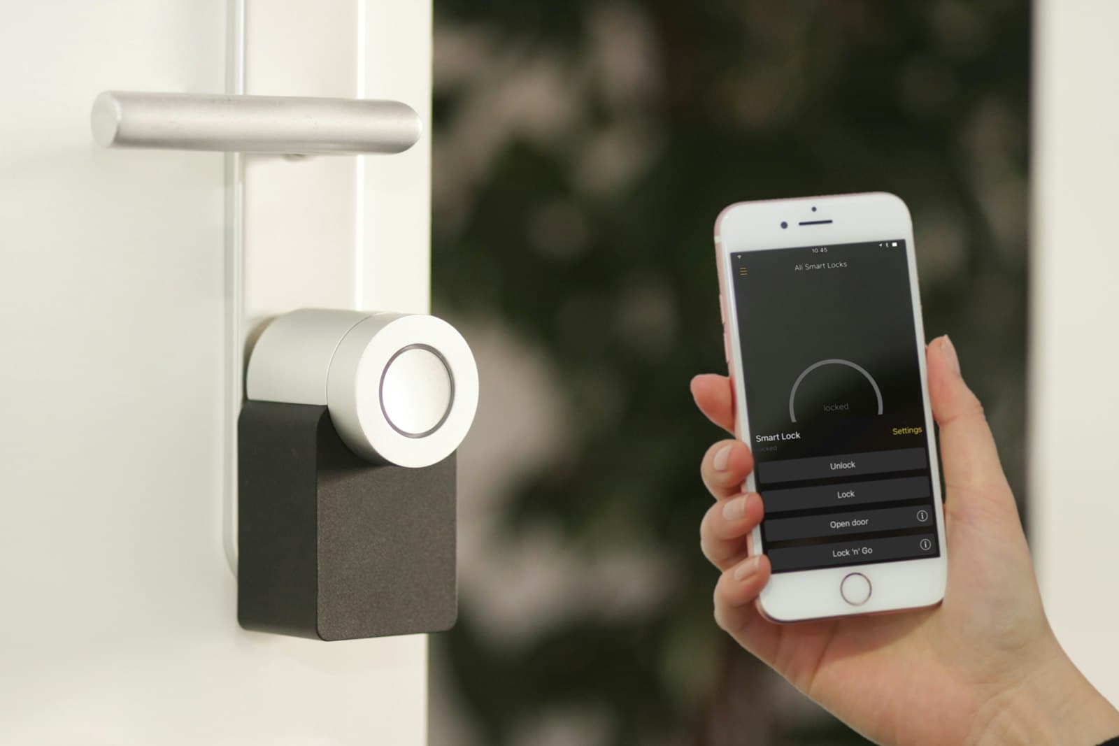 A door lock beside a phone showing a lock screen